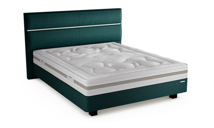 Un matelas en elastorem soja avec un sommier et tête de lit en velours vert émeraude.